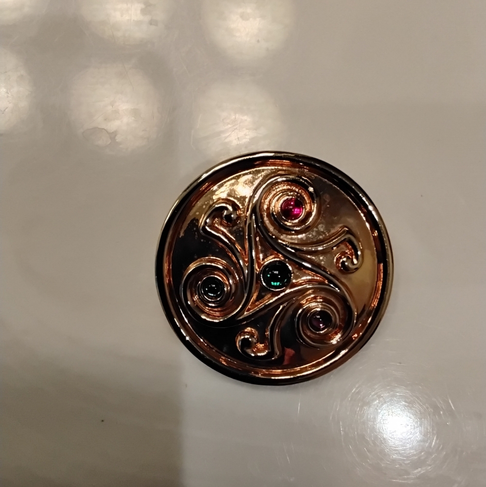Gold Swirl Brooch with Gem Accents
